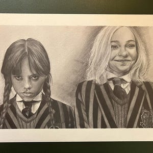 May include: A monochrome pencil drawing of two figures in school attire. One has dark hair in plaits and a serious expression. The other has blonde hair and a subtle smile. Both are wearing striped blazers and ties.