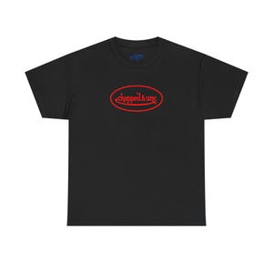 May include: Black t-shirt with a red oval design that reads "chopped & unc" in a stylized font. The shirt is a basic crew neck style, suitable for casual wear.