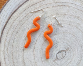 Orange Squiggle drop earrings on silver ear wire, bright lightweight polymer clay