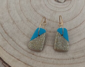 Gold and turquoise blue earrings on gold hoop