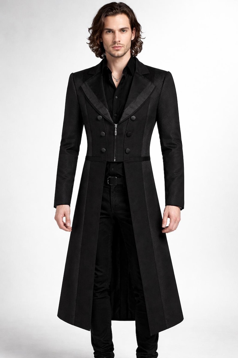 May include: A long, black coat with a double-breasted front, featuring a zipper closure and decorative buttons. The coat has a tailored fit and a long, flowing design, suitable for formal occasions.