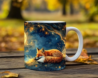 May include: White ceramic mug featuring a sleeping fox illustration under a tree with a full moon. The fox has orange and white fur, set against a blue and gold night sky. The mug is on a wooden surface.