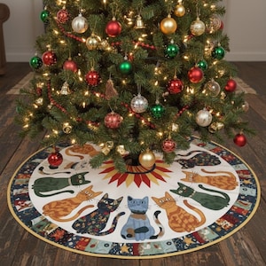 May include: A decorated Christmas tree with red, green, gold, and silver ornaments, and a red garland. The tree sits on a round tree skirt with a white background and a pattern of cats in various colors.
