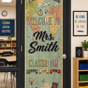 May include: A vertical door decal featuring a vintage world map background with the text A NEW ADVENTURE BEGINS, WELCOME TO, Mrs. Smith, CLASSROOM, EXPLORE, LEARN, and GROW. Graphics include an airplane, compass, hot air balloons, and binoculars.