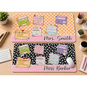 May include: Two rectangular desk mats featuring a checkerboard or star pattern with various sticky note graphics containing inspirational teacher quotes. The top mat is orange and white with the name Mrs. Smith, while the bottom mat is black and white with the name Miss Barker.