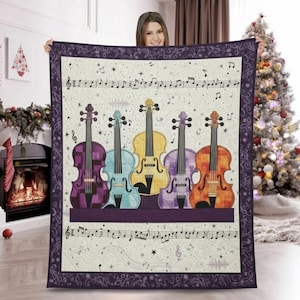 May include: A decorative quilt featuring five colorful violins in purple, blue, yellow, lavender, and orange. The quilt has musical notes and a purple border. The background is off-white with musical symbols.