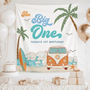 May include: A white backdrop with a beach theme, featuring a vintage orange and white van, palm trees, and ocean waves. Text reads "The Big One" and "Noah's 1st Birthday". Includes a surfboard, balloons, and a cake, perfect for a first birthday party.