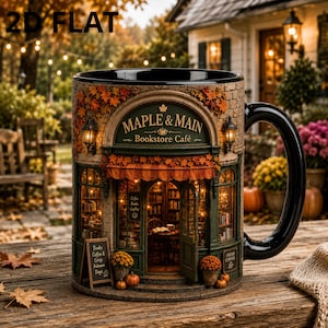 May include: A ceramic mug featuring a detailed 3D relief of a bookstore cafe named Maple & Main. The design includes a brick facade, autumn leaves, lanterns, and a storefront with an open door. A small sign reads Books, Coffee & Crisp Autumn Days.