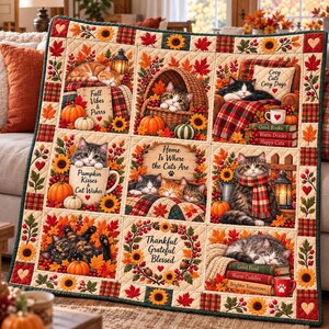 May include: A quilted throw blanket featuring nine panels with cats, pumpkins, sunflowers, and autumn leaves. Text includes Fall Vibes & Purrs, Cozy Cats Cozy Days, Pumpkin Kisses & Cat Wishes, Home Is Where the Cats Are, and Thankful Grateful Blessed.