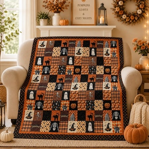 May include: A Halloween-themed patchwork quilt featuring a repeating grid of black and orange squares. The fabric displays various seasonal motifs including ghosts, skeletons, black cats, pumpkins, haunted houses, and witch hats on a dark background.