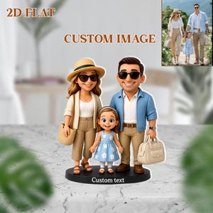 May include: A family figurine with a custom design. The figurine features a mother, father, and daughter, all wearing sunglasses and casual outfits. The text "2D FLAT" and "CUSTOM IMAGE" are at the top. The base has the text "Custom text".