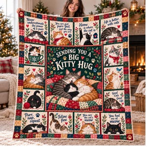May include: A rectangular quilt featuring a central panel with the text "SENDING YOU A BIG KITTY HUG" surrounded by illustrations of cats and various phrases like "Never underestimate the power of a purr" and "You had me at meow" in a grid layout.