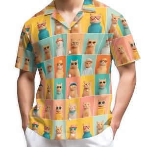 May include: Short-sleeved button-down shirt with a repeating pattern of cats wearing sunglasses, hats, and sweaters. The cats are arranged in a grid against a colorful background of yellow, teal, orange, and pink squares. The shirt has a classic collar.