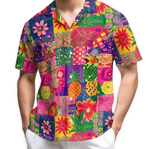 May include: A short-sleeved shirt with a button-down front, showcasing a colourful patchwork design. The shirt displays a collage of floral and pineapple patterns in pink, yellow, green, and blue. The shirt is worn with white trousers.