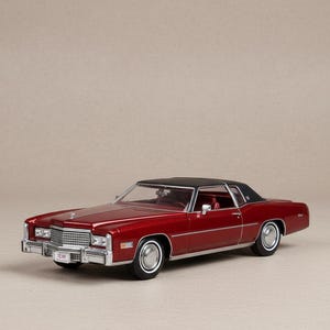 May include: A red classic car with a black roof. The car has chrome accents, white-walled tires, and a license plate that reads "TE MI". The car is a coupe style.