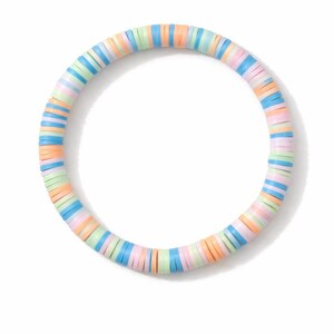 May include: A colorful bracelet composed of flat, round beads in pastel shades of blue, pink, orange, and green. The bracelet is circular and sits against a white background. The beads are uniform in size and shape, creating a smooth, continuous design.
