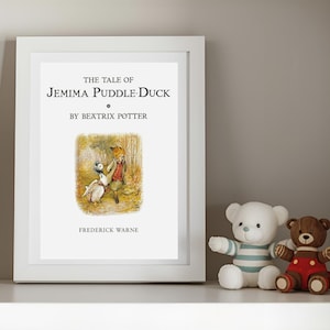 May include: A white framed print featuring the title The Tale of Jemima Puddle-Duck by Beatrix Potter, with an illustration of a duck and a fox in a forest, and the publisher name Frederick Warne printed in black text on a white background.