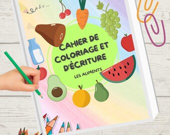 May include: A notebook with the title "Cahier de Coloriage et d'Écriture" featuring fruit and vegetable illustrations. A hand is drawing with a green pencil. Colouring pencils and crayons are also present.