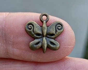 8 Butterfly Charms in bronze tone - C1210