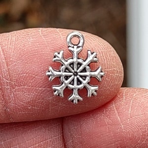 12 SMALL Snowflake Charms in Silver Tone C1000 image 1