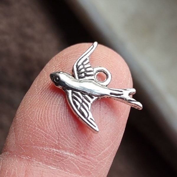 10 Flying Bird Charms in silver tone - C321