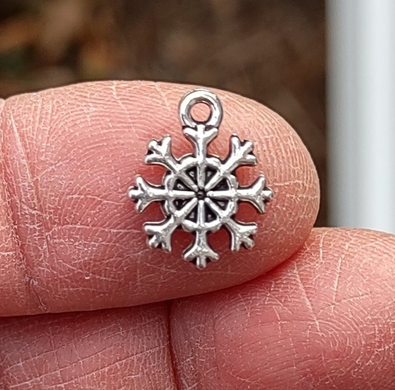 12 SMALL Snowflake Charms in Silver Tone C1000 image 1