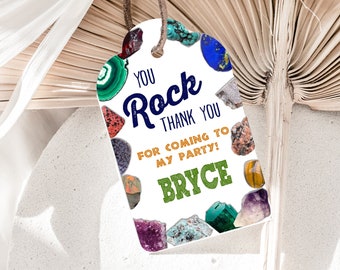 Puede incluir: Etiqueta de favor blanca con ilustraciones de piedras preciosas de colores. El texto dice "You Rock Thank You for coming to my party! Bryce".