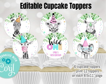 May include: Six colorful cupcake toppers featuring jungle animals wearing party hats. The toppers are printed on white circles with confetti and green leaves. The text "Wild One Emily's First Birthday" is on one of the toppers. The text "Personalize with Coryl" is on a teal circle.