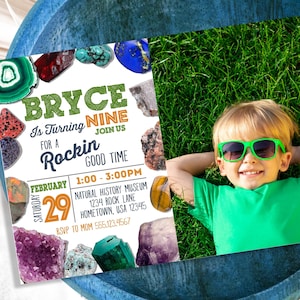 May include: A birthday invitation for a boy named Bryce turning nine. The invitation features a photo of a boy wearing green sunglasses and a green shirt, lying on a grassy lawn. The invitation is decorated with colorful gemstones and the text "Bryce is turning nine, join us for a rockin' good time". The invitation includes the date, time, and location of the party.