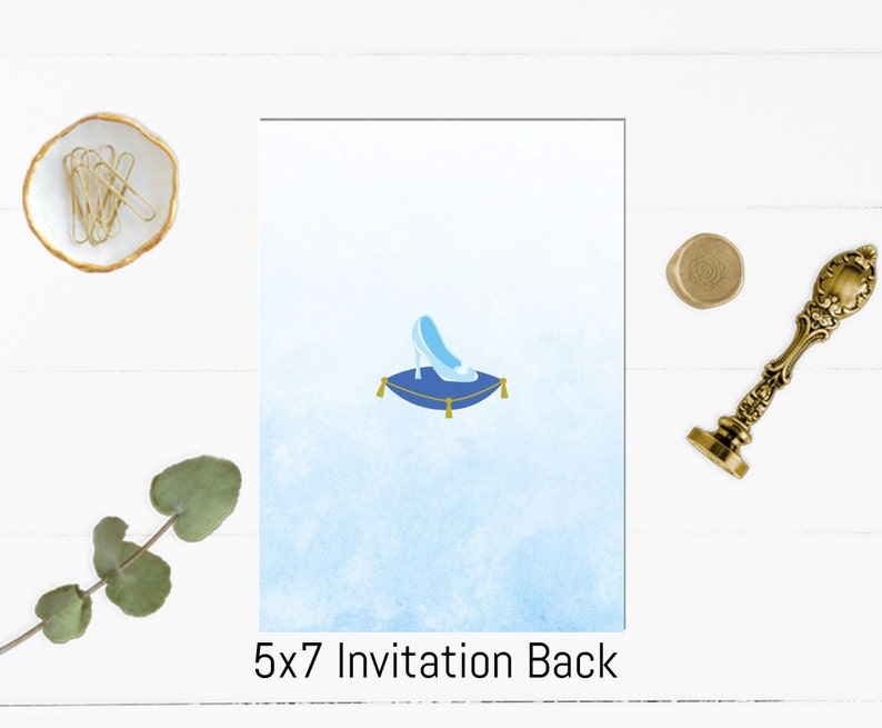 May include: A blue glass slipper sits on a blue cushion with gold trim. The background is a light blue watercolor wash. The text "5x7 Invitation Back" is at the bottom of the image.
