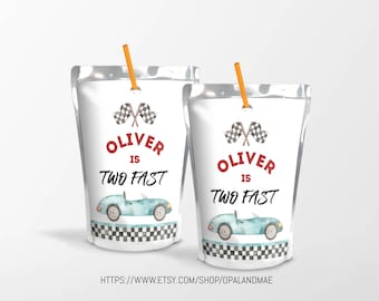 May include: Two juice box pouches with a racing car theme. The pouches are white with black and white checkered borders. The text on the pouches reads "Oliver is Two Fast" with red lettering. Each pouch has a blue race car with a red and white checkered flag.