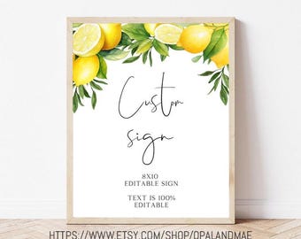 May include: A framed sign with a white background, featuring the words "Custom sign" in elegant script. The top border is adorned with watercolor lemons and green leaves. The sign also includes the text "8x10 Editable Sign" and "Text is 100% Editable."