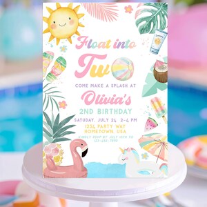 May include: A colorful invitation for a second birthday party. The design features a smiling sun, a flamingo float, and a unicorn. Text includes "Float into Two" and party details. Tropical leaves and beach-themed illustrations surround the text.