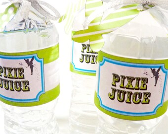 May include: Three clear plastic water bottles with green and white striped labels that say "Pixie Juice". The labels have a blue border and a silhouette of a fairy with wings.