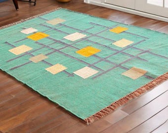 Tapete Kilim de lã e juta tecido à mão: estilo indiano Dhurrie, com design geométrico.