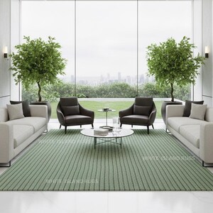 May include: A modern living room with two cream-colored sofas, two dark gray armchairs, and a round coffee table. A green striped rug covers the floor. Two potted trees flank the large window overlooking a cityscape. Artwork hangs on the walls.