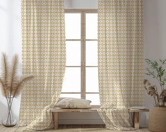 May include: Beige and white patterned curtains hanging in front of a window. The curtains have a geometric design of diamonds and vertical lines. A wooden bench with a pillow sits below the window. A round rug and decorative plants complete the room.