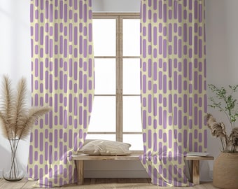 May include: A pair of window curtains with a repeating pattern of vertical purple ovals on a cream background. The curtains are hanging in front of a window, with a wooden bench and a round rug in front of the window.