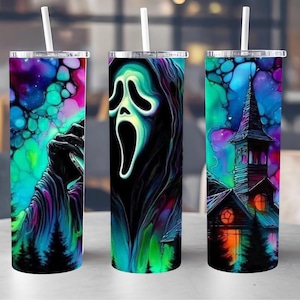May include: Three tall, stainless steel tumblers with white straws. Each tumbler features a different spooky design: a hand reaching out, the Scream mask, and a haunted church. The designs are set against a colorful, galaxy-like background.