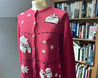 Vintage womens xmas cardigan - Reflections. Red with ebroidered winter clothing, mittens and hats.