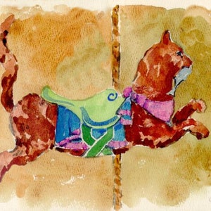 May include: A watercolor painting of a brown cat on a carousel. The cat is wearing a blue and green saddle with a pink and white ribbon. The cat is looking to the right.