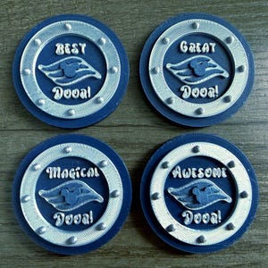 May include: Four navy blue coasters with a silver trim and text. Each coaster has a different word: "Best", "Great", "Magical", and "Awesome". Each coaster also features a stylized image of a boat.
