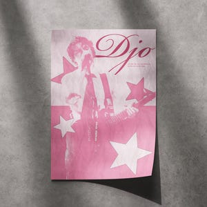 May include: A rectangular poster in shades of pink featuring a monochromatic illustration of a musician playing an electric guitar. The word Djo is printed in a large script font at the top right, accompanied by several white star shapes.