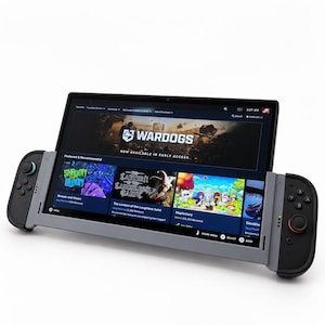 May include: A handheld gaming console featuring a wide rectangular screen displaying a digital storefront with game titles like Wardogs, Shroom and Gloom, and Maplestory. The device has detachable gray controllers on each side with black buttons.
