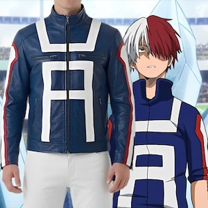 May include: A navy blue leather jacket with white and red accents. The jacket features a large white "A" on the front and back, with a matching design on the sleeves. The jacket is zipped up and worn with white pants. The image also shows a character in a similar outfit.