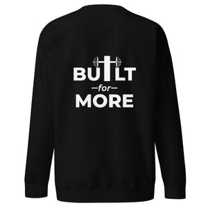May include: Black crew neck sweatshirt with the white text "BUILT -for- MORE" and a barbell-cross graphic. The sweatshirt is a solid black colour.