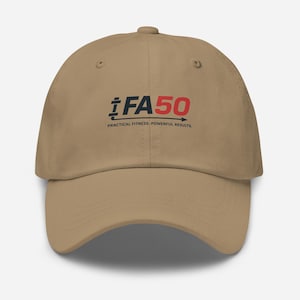 May include: A beige baseball cap featuring the text "FA50" in black and red, with the words "PRACTICAL FITNESS. POWERFUL RESULTS." underneath. The cap has a curved peak and a button on top.