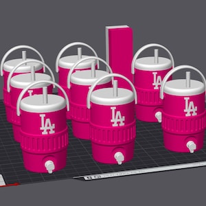 May include: A collection of pink water coolers with white lids and handles. Each cooler features the white "LA" logo. The coolers have a spigot near the bottom and are designed for easy dispensing of liquids.