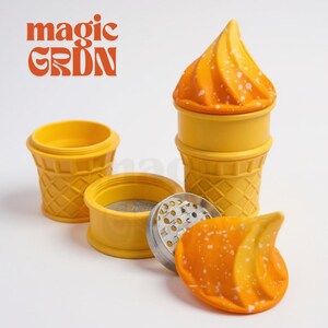 May include: A yellow and orange ice cream cone-shaped grinder with the text "magic GRDN" in orange. The grinder is disassembled, showing the various parts, including a metal grinding plate and a mesh screen.