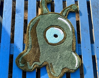 Ręcznie robiony dywanik z motywem ślimaka mózgowego – wystrój inspirowany science fiction w stylu Futuramy